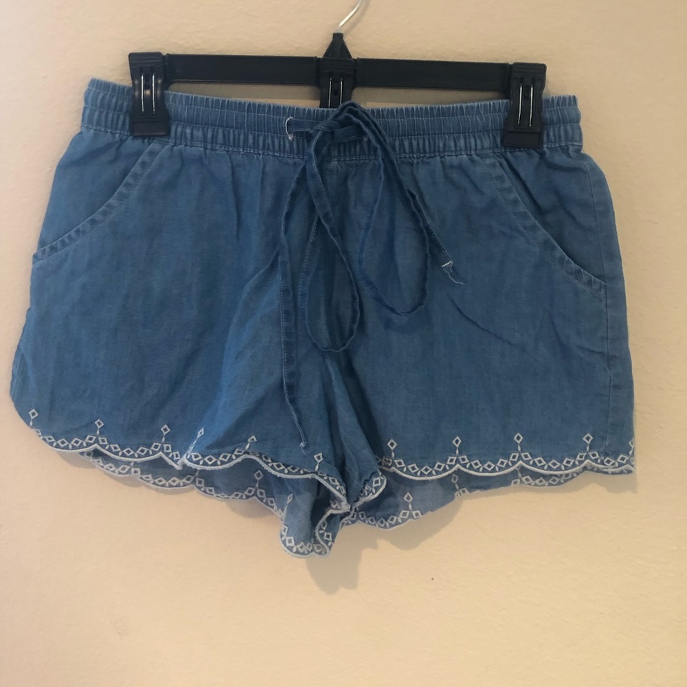Red camel shorts in a size medium.